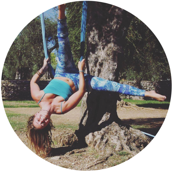 student doing aerial yoga